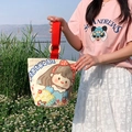 Canvas bucket bag in beige with cartoon girl print and red woven handles - Foodie Girl