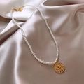 Macro view of gold plated pearl necklace featuring an evil eye coin pendant on silk - 8# Gold Coin Eye Pendant Style