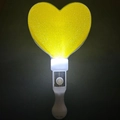 Detail of a glowing yellow heart-shaped LED glow stick for parties and concerts - Thickened Heart Wand Yellow