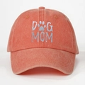 Detail of orange washed cotton baseball cap featuring DOG MOM text and paw print logo - One Size / Orange