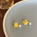 Detailed close-up of yellow flower earrings with white pearls on a blue ceramic plate - Yellow Flower Cluster Pearl Style (Style 3)