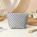 Chic silver quilted makeup bag with metallic finish and secure zipper closure - Trapezoid Bag / Silver Gray