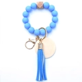 Detail of sky blue silicone beads with wooden hex bead and leather tassel keychain - Sapphire Blue