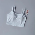 Débardeur de sport blanc avec fines bretelles et coussinets en fibre Lycra - S / Hauts / Blanc
