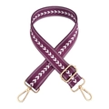 Detail of purple nylon strap with white arrow patterns and adjustable gold metal buckles - Deep purple