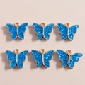 Set of six blue butterfly alloy pendants with sequins for DIY jewelry making - Blue