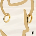 Detail of 18K gold hoop earrings with black enamel inlay on an artistic jewelry stand - 3*15mm / Black