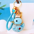 Sparkling duck keychain with blue woven strap and gold crown decoration on cup - Sky Blue Rope + Blue Duck