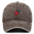 Close-up of strawberry embroidery on vintage washed dark brown cotton baseball cap - Coffee