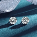 Sparkling silver flower moissanite stud earrings with a large center stone and small accents - Snowflake Four-Prong Studs