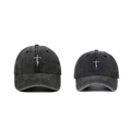 Detail view of washed cotton baseball caps with FAITH cross embroidery in two sizes - Black