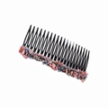 Dettaglio del pettine per capelli nero con decorazioni in pietre rosa e grigio-bluastre - Pettine per Capelli Rosa