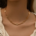 Close-up of golden coffee bean link chain necklace worn on a neck with a high-polished finish - Gold Pig Nose Mariner Link Necklace (KN0119) / 18K Gold