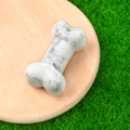 Miniature white marble bone carving with grey veins on wooden base for DIY decor - Howlite