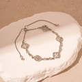 Detail of adjustable silver clover bracelet with sparkling pave-set crystal flowers - Silver Rhinestone Clover (HB3089)