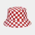 Macro detail of red and white checkerboard canvas fabric on a reversible bucket hat - One Size / Red