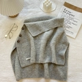 Chic grey knit turtleneck poncho with decorative brown buttons for a winter layered look - Gray