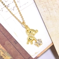Golden necklace with a zircon-encrusted bear pendant holding a star on vintage envelope - Gold Bear Star Pendant (ZYN-DMK634G-A11)