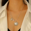 Detail of seashell and starfish pendant necklace with small white beads on a model - Silver Marine Beaded Pearl Necklace(A-886)