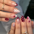 Elegant red and white almond-shaped press-on nails with star and polka dot designs. - JP4278 Style