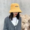 Ginger yellow fleece bucket hat with cute bear ears for winter warmth on model - Yellow Lamb Wool Bucket Hat