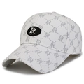 White baseball cap with grey logo pattern and black oval metal emblem from a side view - Adjustable / White