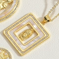 Macro shot of gold square pendant with mother of pearl Virgin Mary and zircon border - Square Virgin Mary