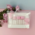 Travel toiletry set with transparent bottles and pink lids in a clear zipper pouch - No-Logo 9-Piece Set / Pink