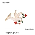 White enamel dove brooch with rhinestones and size labels, 5.9cm by 4.0cm, weighing 9.7g - White