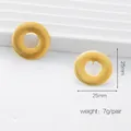 Golden 25mm round stainless steel studs with radial texture and 7g weight per pair - Round Radial Texture / Gold