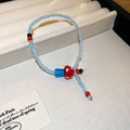 Blue beaded bracelet featuring a red and white polka dot mushroom pendant in a gift box - Blue-Red-Mushroom