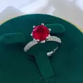Macro shot of a classic six-prong setting ring with a deep red round-cut gemstone - A1 Open Type / Red