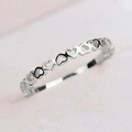Minimalist hollow heart-shaped silver ring for women featuring a continuous band design - US 5 / White Gold