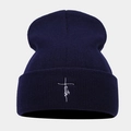Detailed view of faith cross embroidery on navy blue ribbed knit beanie hat cuff - Navy Blue
