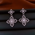 Detailed close-up of crystal flower drop earrings with silver plating and zircon stones - Earrings (Silver)