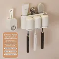 Creamy white wall-mounted toothbrush holder set with 3 magnetic cups and toothpaste dispenser - Three Cups with Dispenser