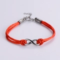 Detailed view of handmade orange cord bracelet with silver infinity symbol and lobster clasp - Silver (Red Rope)