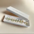 Five pairs of pearl earrings set in gold finish, featuring white and pastel colors - White (Clip-on Pair)