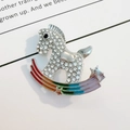 Detailed close-up of crystal-inlaid rocking horse brooch with rainbow enamel finish - Silver Full Rhinestone Rainbow Rocking Horse (XZ99 Silver Large)