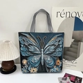 Ethnic blue canvas tote bag featuring 3D butterfly embroidery and striped woven handles - Blue Butterfly