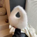 Chic off-white fluffy faux fur handbag in a unique triangular shape with top handle - Off White