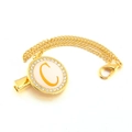 Detailed view of golden pacifier clip with crystal rhinestone letter C on white enamel - Letter C