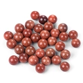 Polished round goldstone crystal beads with shimmering gold flakes on white background - Synthetic Goldstone