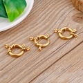 Three gold round spring ring clasps for jewelry making on a natural wood surface - 14mm / Gold