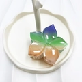 Floral hair claw clip with colorful gradient finish on a white jewelry display tray - Blue+Green+Orange (Rainbow Five-petal Flower)