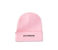 Close-up of NOT INTERESTED black embroidery on a pink cuffed winter beanie hat - M (56-58cm) / Pink
