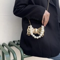 Detail of golden bow handbag with large pearl handle and metal chain on black blazer - Rose Gold Style 2 (Pearl Handle)