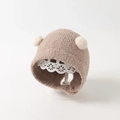 Infant winter earmuff hat in khaki plush with two white fluffy pom-poms for warmth - Small Ball Hat / Mocha