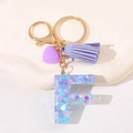 Purple heart tassel keychain with resin letter F pendant and blue glitter infill - Letter F