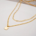 Collana a doppio strato in acciaio al titanio dorato con ciondolo Good Luck e girasoli - Pendente Good Luck Doppio Strato
